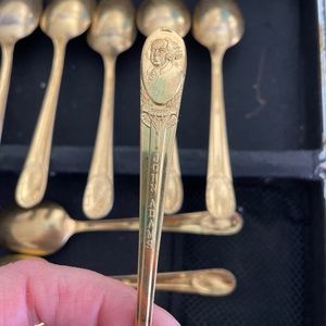 Gold colored, set of nine presidential spoons